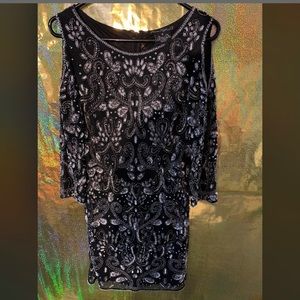Woman’s black beaded dress worn once